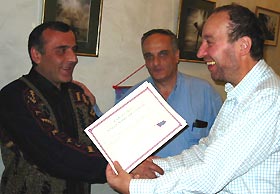 Peter Barham presenting certificate to Hamlet Network Members the Union of Users and Ex-users of Georgia